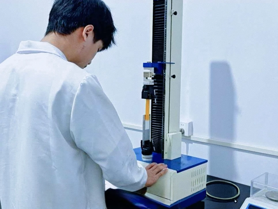 Technician testing a film sample